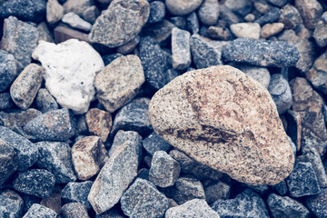 Small and big smooth round pebbles, sea dry stones, multicolour gray gravel. Abstract Composition Textured background. Ideal for web banner design