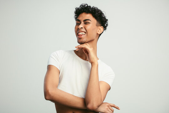 Gay Man With Happy Face Winking At Camera