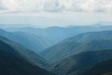 scenic clouds in beautiful mountains in summer day