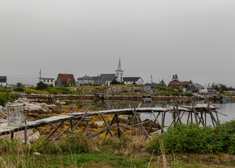 Fototapeta na wymiar Old wharf and a church, Prospect Village, Nova Scotia