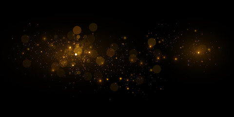 Transparent golden light effect. Magical sparkles isolated on black background.
