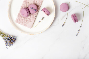 flat lay sweets, pink chocolate with lavender and macaroons
