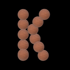 Letter of the alphabet made with circular wooden silhouettes. Isolated on black background