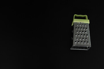 grater on black background