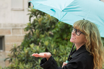 woman with umbrella on the street on a rainy day