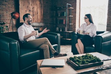 Photo of two business people share corporate news drink hot coffee mug beverage break chatting...