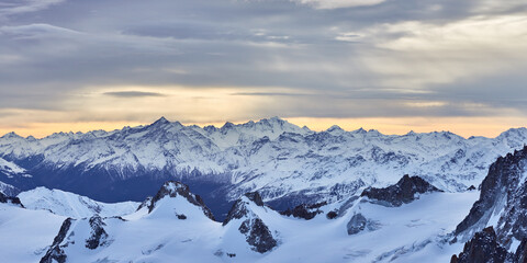 Panoramic view of the winter mountains at sunset near Chamonix in France.