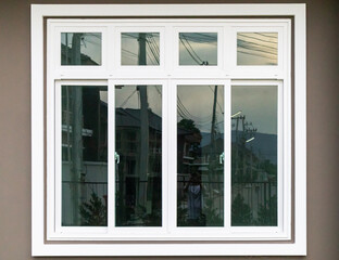 Fototapeta na wymiar Modern window frame outside the house