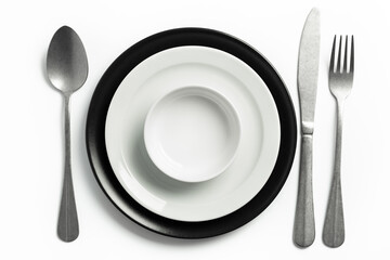 individual crockery and cutlery set on a white table