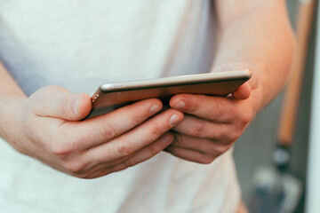 shot of male hands holding modern tablet pc mock-up outdoors