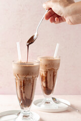 pouring milk into a glass