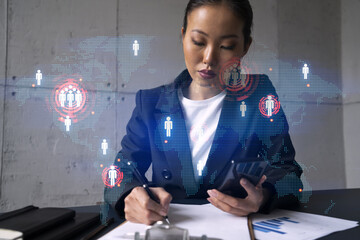 Businesswoman taking notes and world map hologram. Double exposure. Technology security network solution planet earth international business concept.