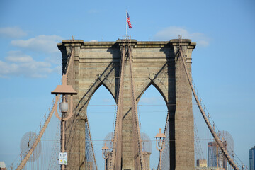 Fototapeta premium New York, NY, USA - June 3, 2019: Brooklyn Bridge connects Manhattan and Brooklyn