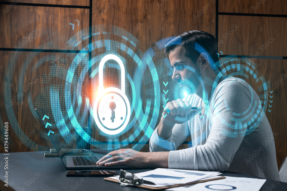 Poster a serious caucasian programmer in casual wears, using laptop to develop a new security system to pro