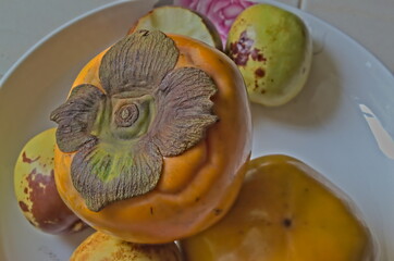 Persimmons in the plate