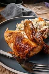 Roast chicken served with russian traditional salad.