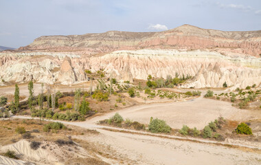 Unique colorful sandstone rock formations in the Rose Valley. Central Anatolia, Cappadocia, Turkey