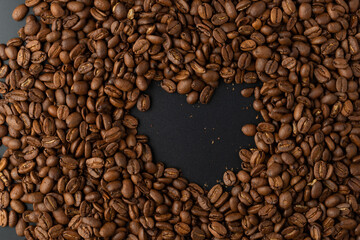 Close-up studio shot of freshly roasted espresso coffee beans.