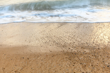 Sandy beach along the Atlantic coast in a summer evening.