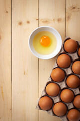 Egg yolk in small bowl. Food ingredient for hight protein.
