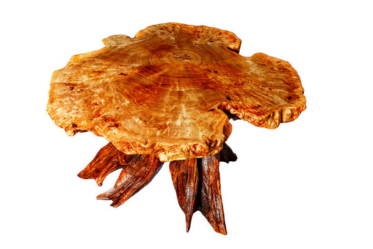 Stylish wooden table is carved from solid wood root and covered with wax.