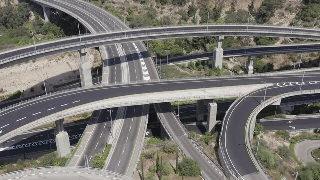 Corona Virus second lockdown, massive highway interchange roads with no traffic due to Government guidelines, Aerial view.