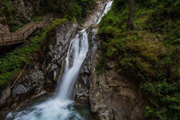 beautiful long waterfall in a gorge