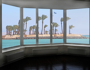 Cozy room overlooking sea. Landscape with ocean. Window with beautiful panorama