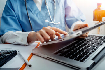 Medical technology concept The doctor works with mobile phones, headphones and tablets. Digital laptop in the modern office at the hospital in the morning