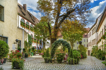 Courtyard with tree n Regensburg city center, Germany