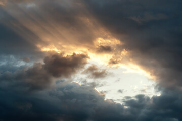 Naklejka na ściany i meble Low angle view of cloudy sky during sunset