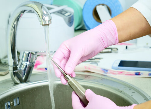Dental instrument disinfection. Rinse a medical instrument under running water. Disinfection in a medical center, hospital, office. Patient Care The best care for a medical instrument.