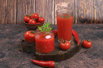 Tomato juice, sauce, pasta and ingredients on a specific table. Detox diet and weight loss concept,...