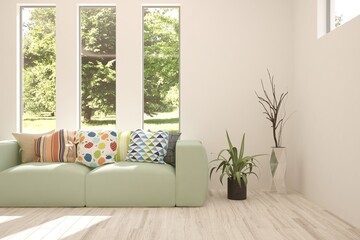 Idea of white room with sofa and summer landscape in window. Scandinavian interior design. 3D illustration