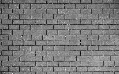 Stretcher bond type brick wall in black and white photo, paving stones pattern, colorless background