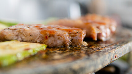 grilling mushrooms and meat on the stone