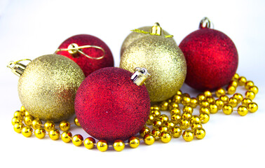 Yellow and red Christmas balls on a white background. Christmas balls on the white background