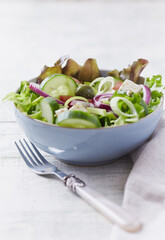 Salad with Green Olives, Cucumber and Feta Cheese. Bright wooden background