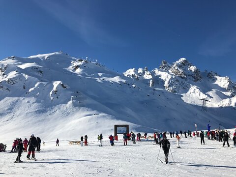 skiers on the top of the mountain