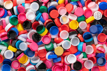 Colored plastic bottle caps, plastic recycling, colorful background, closeup