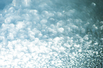 Abstract blurred sparkle bokeh background with glitter lights.