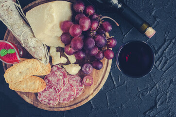 Wooden board full of mediterranean appetizers
