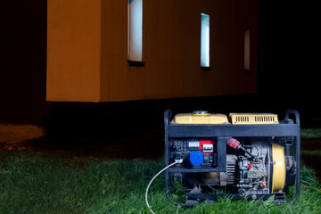 street lighting. night. The generator is yellow. Generates electricity. Used as a backup power supply.