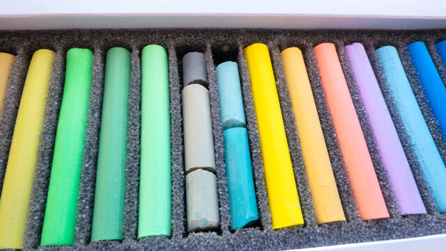 multicolored kids colored crayons set in a box