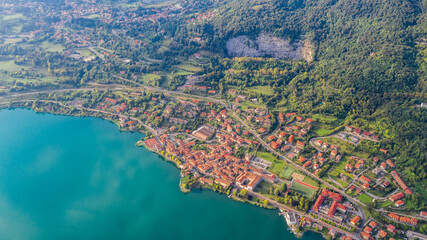 Aerial view from the drone of the landscape of a small town on the shores of lake Como, Italy.