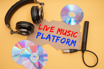 Headphones and music discs. Inscription Live music platform