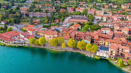 Fototapeta na wymiar Aerial view from the drone of the landscape of a small town on the shores of lake Como, Italy.