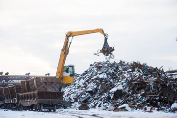 Crane-loading scrap in a train