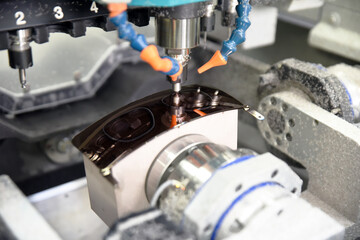 Industrial production of eyeglasses and sunglasses in a factory. Industrial laser machinery during the work of shaping the frame and lenses.  Concept production of accessories for fashion market.