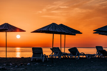 Beach umbrellas at sunrise